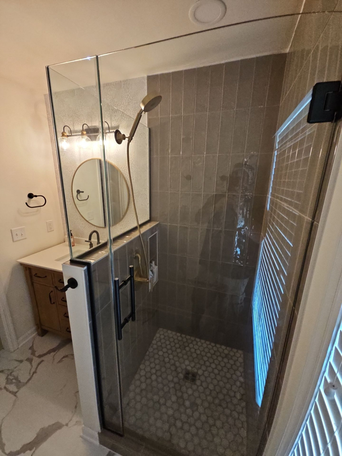 Glass shower enclosure and tile details