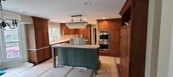 A kitchen island with cooking and downdraft ventilation.